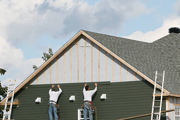 Professional Siding technician working in Columbia, MD